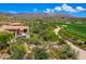 An elegant home with desert landscaping situated near a golf course, offering a serene setting at 40853 N 94Th St, Scottsdale, AZ 85262
