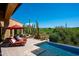 Relax by the pool with views of the golf course and desert landscape at 40853 N 94Th St, Scottsdale, AZ 85262