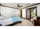 Spacious bedroom with access to bathroom and patio, providing comfort and relaxation at 40853 N 94Th St, Scottsdale, AZ 85262