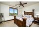 Bedroom featuring a four-poster bed and scenic views of the golf course at 40853 N 94Th St, Scottsdale, AZ 85262