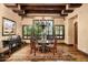 Formal dining room with wood floors, chandelier, and beamed ceilings providing an elegant setting at 40853 N 94Th St, Scottsdale, AZ 85262