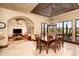Dining room features desert views and leads to a living area, blending indoor-outdoor living at 40853 N 94Th St, Scottsdale, AZ 85262