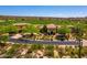 Stunning view of the tile roofed luxury home set adjacent to a lush golf course and beautiful desert landscape at 40853 N 94Th St, Scottsdale, AZ 85262