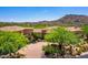 Beautiful estate with a paver driveway and mature desert landscaping near a golf course at 40853 N 94Th St, Scottsdale, AZ 85262
