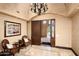 Elegant foyer with tile floors, a decorative chandelier, and views to the outside at 40853 N 94Th St, Scottsdale, AZ 85262