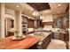 Gourmet kitchen with granite countertops, stainless steel appliances, and a central island at 40853 N 94Th St, Scottsdale, AZ 85262