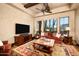 Spacious living room boasting a ceiling fan, desert views, and a cozy rug at 40853 N 94Th St, Scottsdale, AZ 85262