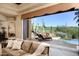 Open living area with a view of the outdoor pool and desert landscape at 40853 N 94Th St, Scottsdale, AZ 85262