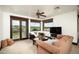 Inviting living room with a ceiling fan and views of the golf course at 40853 N 94Th St, Scottsdale, AZ 85262