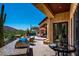 Cozy outdoor patio featuring a built-in BBQ area, ample seating, and beautiful desert views at 40853 N 94Th St, Scottsdale, AZ 85262