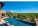 Enjoy a refreshing outdoor pool with lush landscaping and golf course views at 40853 N 94Th St, Scottsdale, AZ 85262