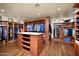 Spacious walk-in closet with custom shelving, center island, and hardwood floors, designed for organization at 40853 N 94Th St, Scottsdale, AZ 85262