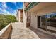 A cozy balcony space with tiled flooring and sliding glass doors, perfect for outdoor relaxation at 4354 N 82Nd St # 178, Scottsdale, AZ 85251