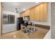 Functional kitchen with a breakfast bar, offering plenty of counter space and storage at 4354 N 82Nd St # 178, Scottsdale, AZ 85251