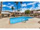 Community pool with lounge chairs and a shady table area, perfect for residents' relaxation at 4354 N 82Nd St # 178, Scottsdale, AZ 85251