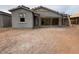 An unfinished backyard shows the beginning stages of a new construction home at 46886 W Coe St, Maricopa, AZ 85139