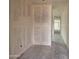 Bright hallway with smooth concrete floors leads to natural light from windows at 46886 W Coe St, Maricopa, AZ 85139