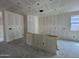 Open concept living room showing drywall with stub outs for electric and gas at 46886 W Coe St, Maricopa, AZ 85139
