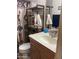 Bathroom showcasing the sink, vanity, toilet, decorative shelving and a Southwestern-themed shower curtain at 5425 N Black Cyn Hwy, Phoenix, AZ 85015