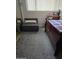 Cozy bedroom with comfortable ottoman seat, closet and bright window at 5425 N Black Cyn Hwy, Phoenix, AZ 85015
