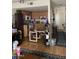 Open kitchen and dining area with updated appliances and dining table at 5425 N Black Cyn Hwy, Phoenix, AZ 85015