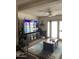 Comfortable living room featuring a large flat screen TV, ceiling fan, and patio doors at 5425 N Black Cyn Hwy, Phoenix, AZ 85015