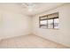 Neutral bedroom with a ceiling fan and a window view to the outdoors at 5529 W Virginia Ave, Phoenix, AZ 85035