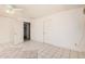 Bedroom with tile flooring and a ceiling fan, offering comfort and functionality at 5529 W Virginia Ave, Phoenix, AZ 85035