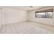Bright bedroom with tile flooring and a window, offering a comfortable and inviting space at 5529 W Virginia Ave, Phoenix, AZ 85035