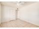 Neutral bedroom featuring a ceiling fan and a view to another room at 5529 W Virginia Ave, Phoenix, AZ 85035