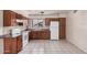 Well-lit kitchen featuring wood cabinets, providing a practical space for cooking and storage at 5529 W Virginia Ave, Phoenix, AZ 85035
