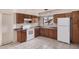 Functional kitchen with wood cabinetry, offering ample storage and space for culinary endeavors at 5529 W Virginia Ave, Phoenix, AZ 85035