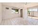 Spacious living room featuring neutral paint, a ceiling fan, and tile flooring at 5529 W Virginia Ave, Phoenix, AZ 85035
