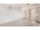 Open living room with tile flooring, offering a clean and adaptable space for relaxation and entertainment at 5529 W Virginia Ave, Phoenix, AZ 85035