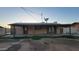 Back exterior with covered patio and mature landscaping at 5739 N 62Nd Dr, Glendale, AZ 85301