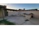 Backyard with built-in firepit and outdoor kitchen, perfect for entertaining at 5739 N 62Nd Dr, Glendale, AZ 85301