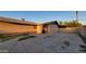 Wide driveway, offering ample space for parking, leads to gated entryway at 5739 N 62Nd Dr, Glendale, AZ 85301