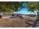 Spacious backyard with pool, patio, mature shade trees, and room to relax at 6038 E Hobart St, Mesa, AZ 85205