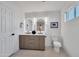 Elegant bathroom featuring double vanity, modern lighting, and contemporary design at 6038 E Hobart St, Mesa, AZ 85205