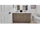 Bathroom featuring double sinks, vanity, with modern fixtures and decor at 6038 E Hobart St, Mesa, AZ 85205