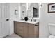 Bright bathroom featuring a double vanity, modern lighting, and stylish fixtures at 6038 E Hobart St, Mesa, AZ 85205