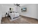 Serene bedroom features a ceiling fan, natural light, and neutral color palette for relaxing retreat at 6038 E Hobart St, Mesa, AZ 85205