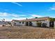 Charming single-story home with a brick exterior, mature landscaping, and well-maintained front yard at 6038 E Hobart St, Mesa, AZ 85205