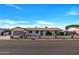 Charming single-story home featuring well-maintained landscaping and a paved driveway at 6038 E Hobart St, Mesa, AZ 85205