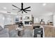 Bright and airy living room featuring modern fireplace, hardwood floors, and plenty of natural light at 6038 E Hobart St, Mesa, AZ 85205