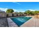 Backyard pool surrounded by lush landscaping at 6038 E Hobart St, Mesa, AZ 85205