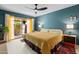 Bright bedroom with a king bed, a sliding glass door to the backyard, and modern decor at 6222 N 21St Dr, Phoenix, AZ 85015