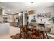 Inviting dining room with stylish furnishings, view to the modern kitchen, and contemporary light fixture at 6222 N 21St Dr, Phoenix, AZ 85015