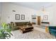 Bright living room featuring a comfortable sofa, modern lighting, and inviting atmosphere at 6222 N 21St Dr, Phoenix, AZ 85015