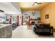 Bright and airy living room featuring an open concept layout, fireplace, and access to the dining area at 6222 N 21St Dr, Phoenix, AZ 85015